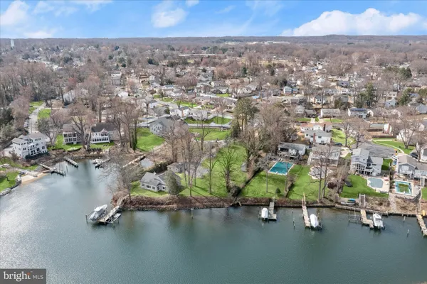 an aerial view of a houses with a street