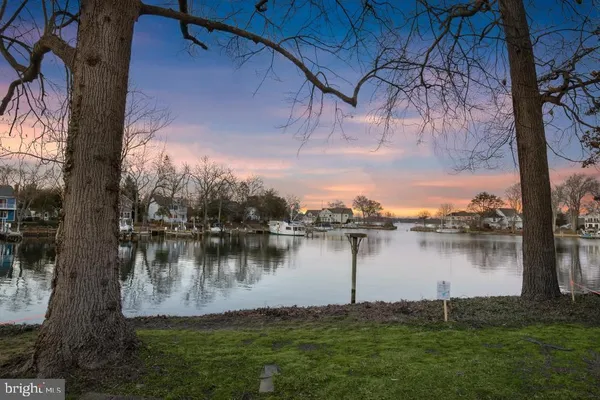 a view of a lake with a yard