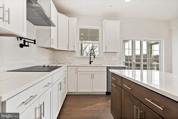 a kitchen with sink cabinets and window