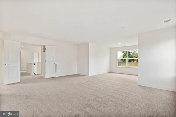 a view of empty room with windows