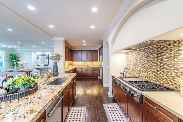 a kitchen with a sink and living room