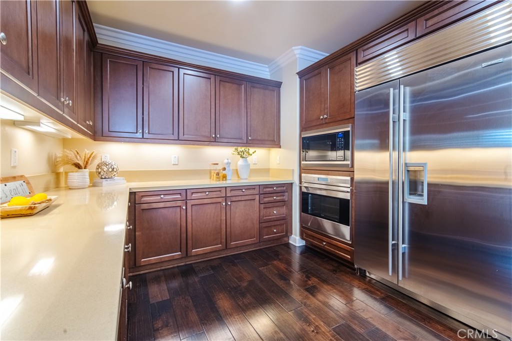 65 Rolling Irvine, CA 92620 - Photo 18 of 54 a kitchen with a refrigerator and cabinets