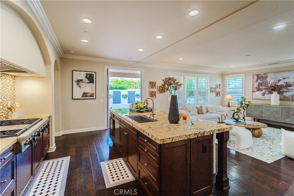 65 Rolling Irvine, CA 92620 - Photo 20 of 54 a open kitchen with a stove a sink and a refrigerator