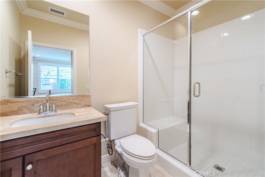 65 Rolling Irvine, CA 92620 - Photo 23 of 54 a bathroom with a sink toilet and shower