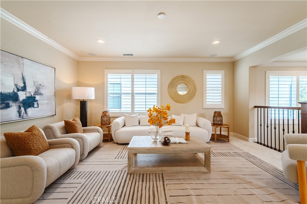 65 Rolling Irvine, CA 92620 - Photo 27 of 54 a living room with furniture and a large window
