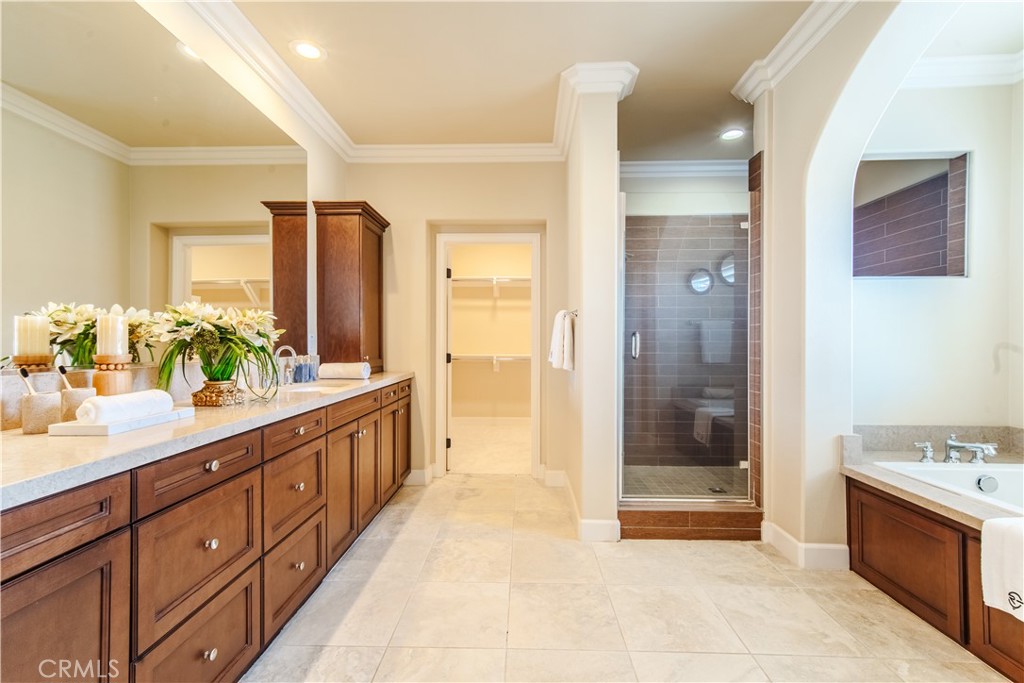 65 Rolling Irvine, CA 92620 - Photo 33 of 54 a spacious bathroom with a granite countertop sink mirror and shower