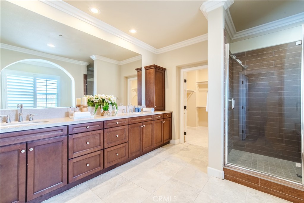65 Rolling Irvine, CA 92620 - Photo 34 of 54 a spacious bathroom with a granite countertop sink mirror and shower