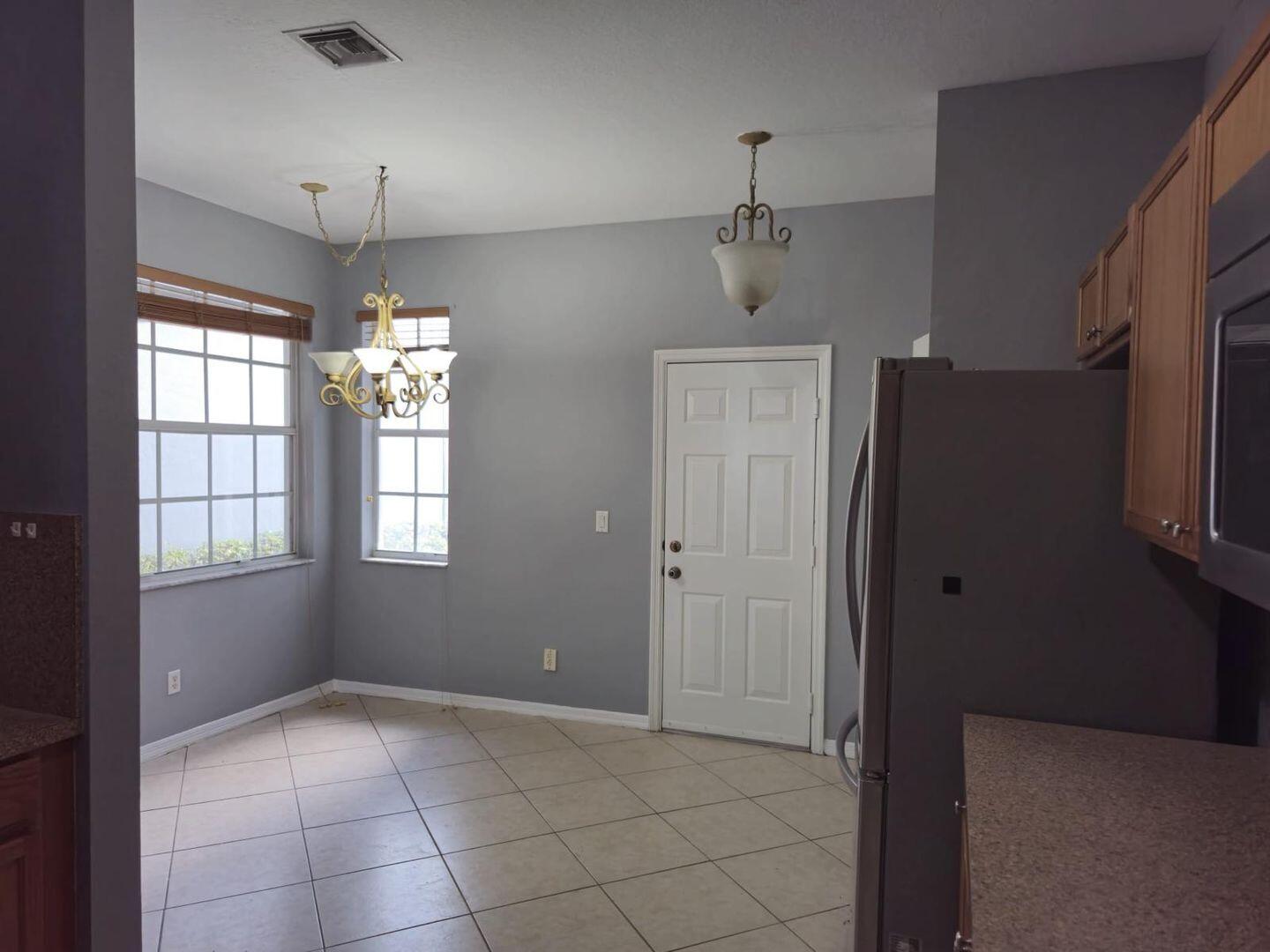 3123 Grandiflora Drive Greenacres, FL 33467 - Photo 11 of 49 a view of an empty room with a window