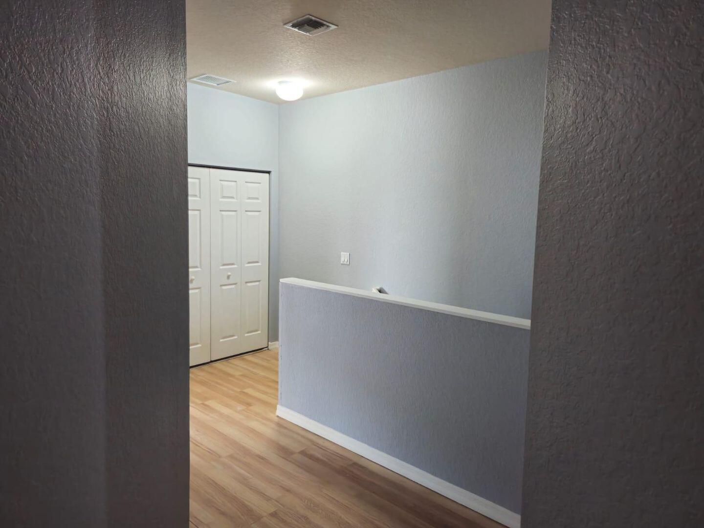 3123 Grandiflora Drive Greenacres, FL 33467 - Photo 20 of 49 an empty room with wooden floor