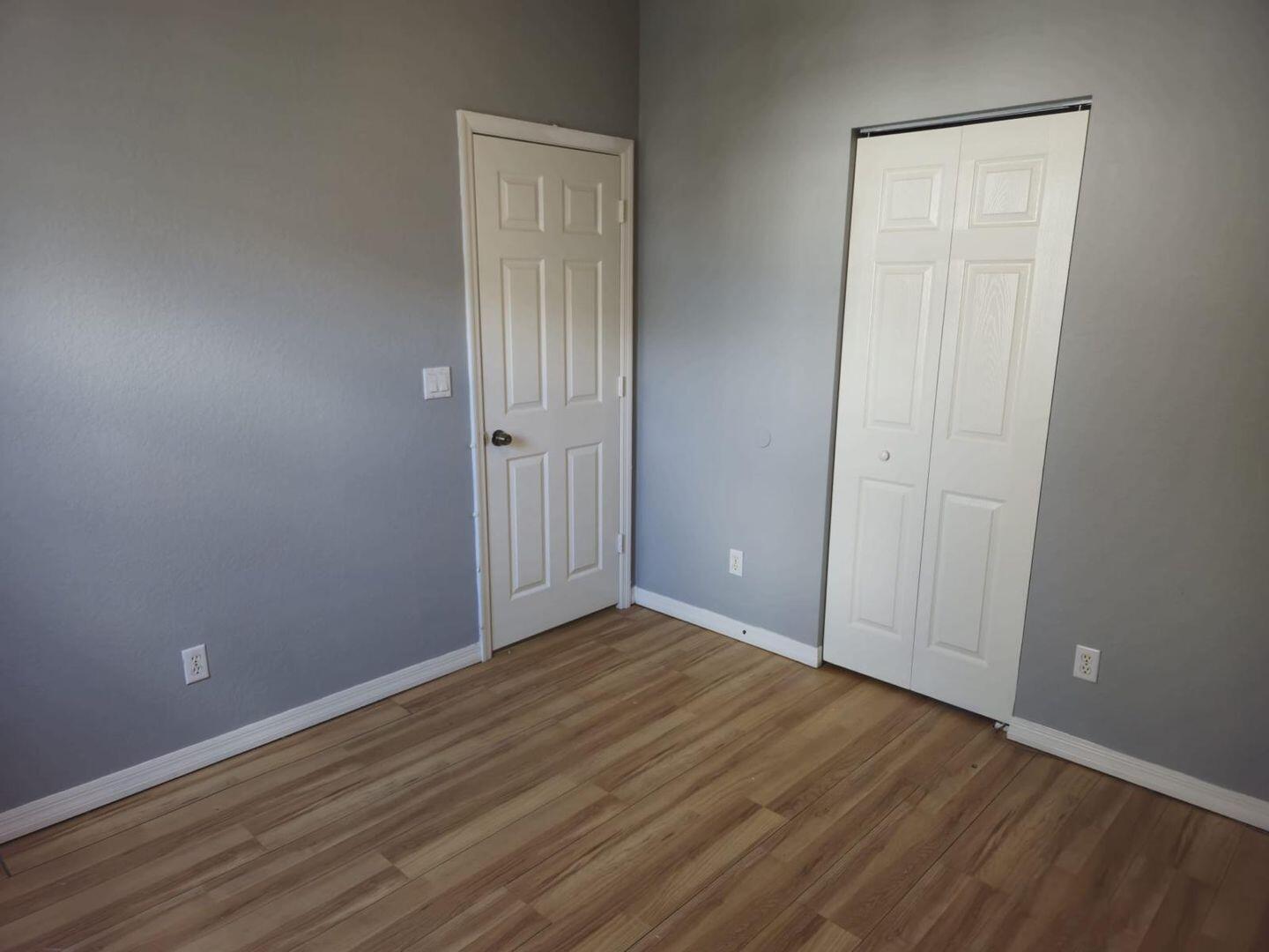 3123 Grandiflora Drive Greenacres, FL 33467 - Photo 30 of 49 an empty room with wooden floor and closet