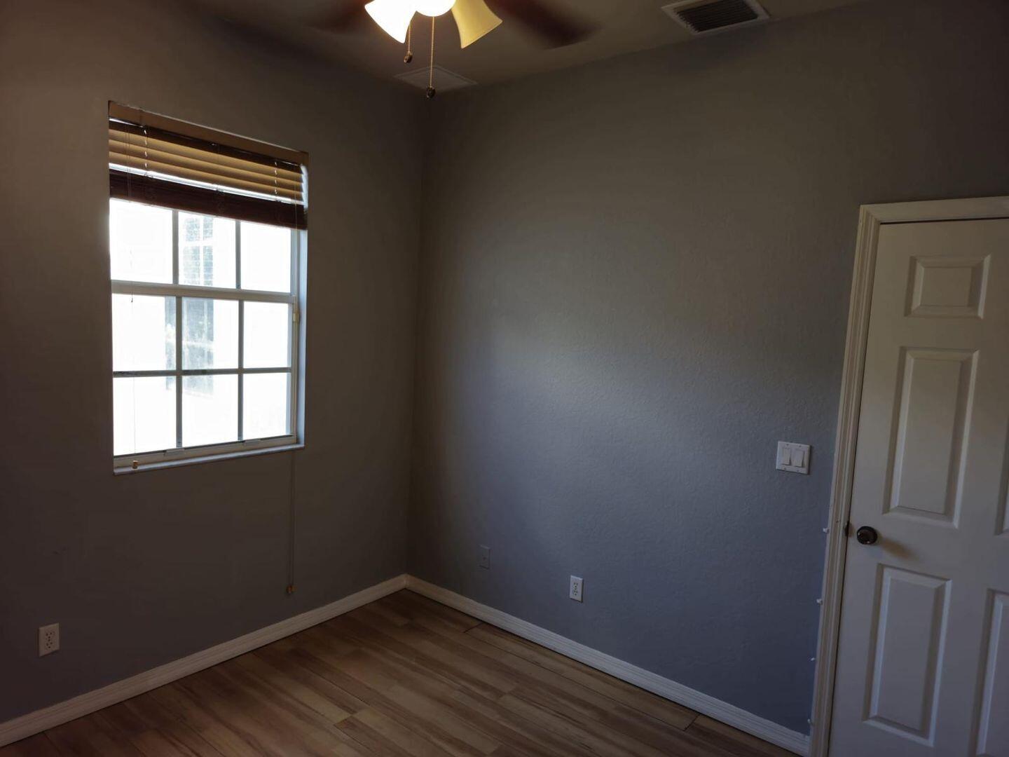 3123 Grandiflora Drive Greenacres, FL 33467 - Photo 31 of 49 an empty room with a window