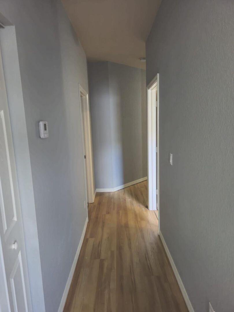 3123 Grandiflora Drive Greenacres, FL 33467 - Photo 33 of 49 a view of hallway with wooden floor