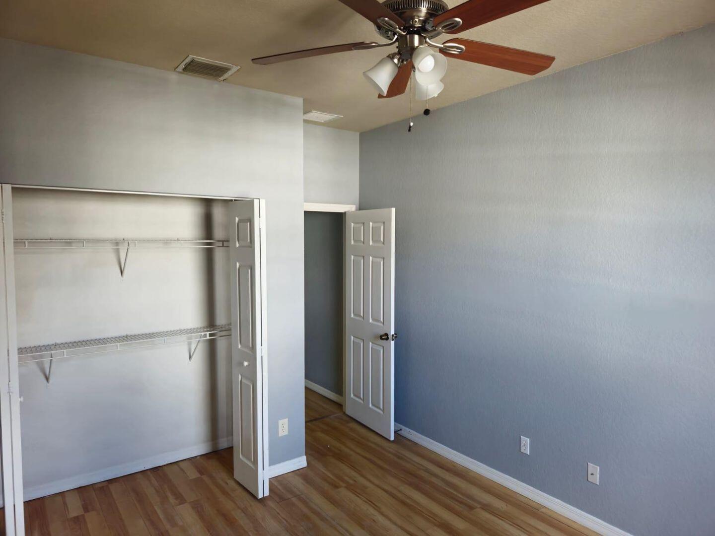 3123 Grandiflora Drive Greenacres, FL 33467 - Photo 34 of 49 a view of an empty room with wooden floor