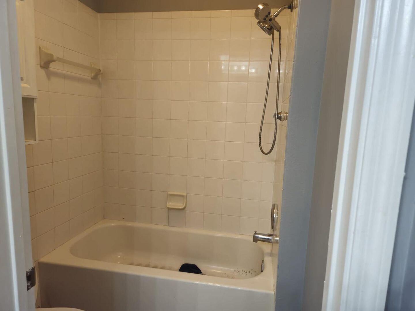 3123 Grandiflora Drive Greenacres, FL 33467 - Photo 38 of 49 a bathroom with a bath tub and a shower