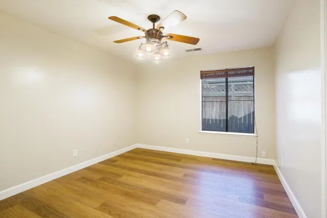 a view of a house with swimming pool and yard