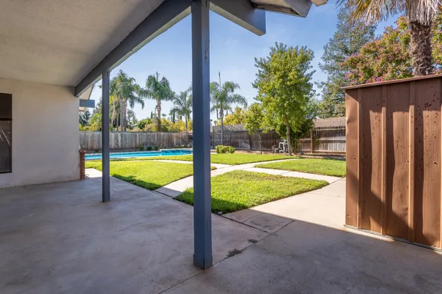 an aerial view of a house with a swimming pool