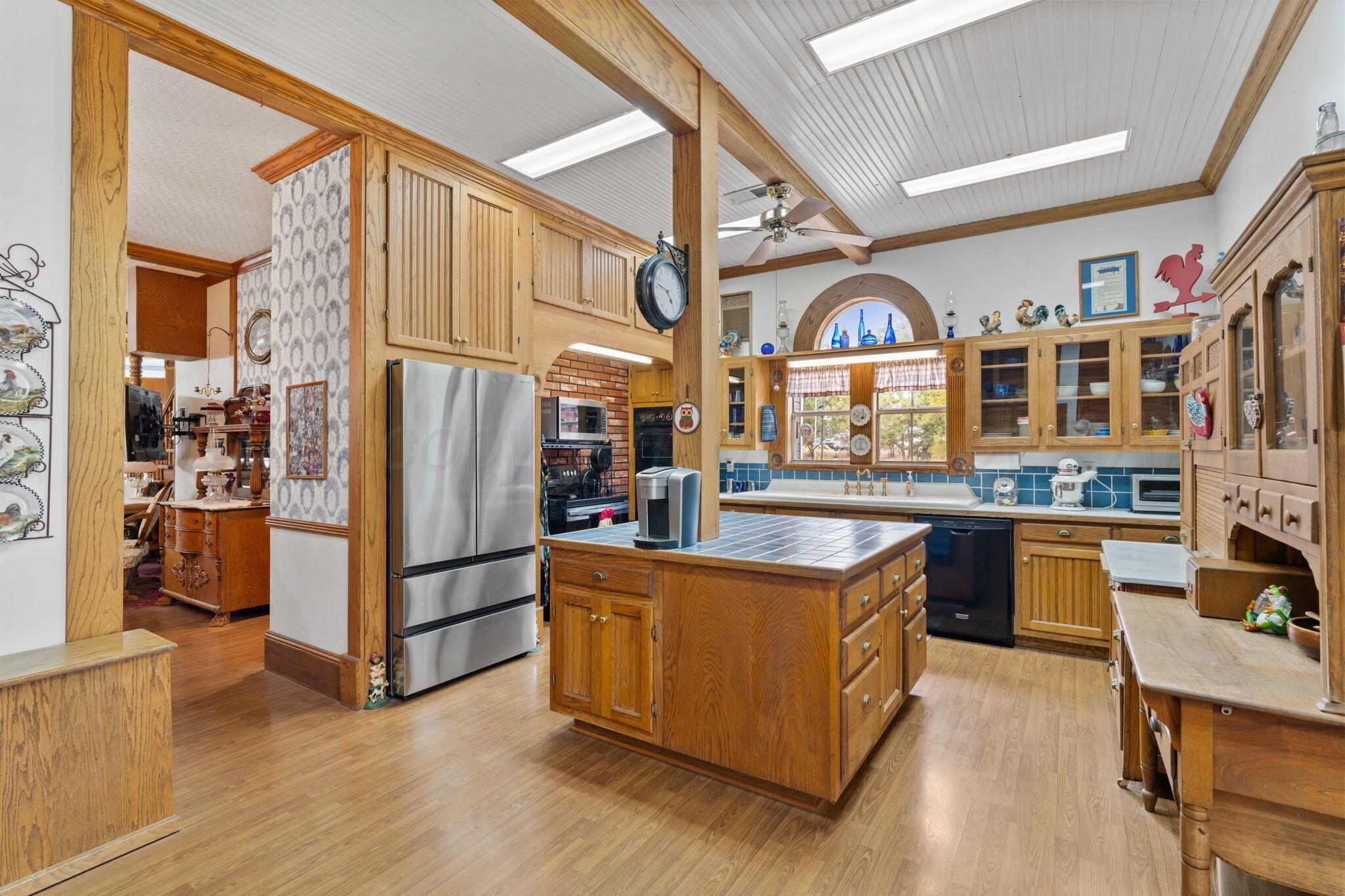2403 Maple Lane Kingsland, TX 78639 - Photo 17 of 46 a kitchen with stainless steel appliances granite countertop a stove and a refrigerator