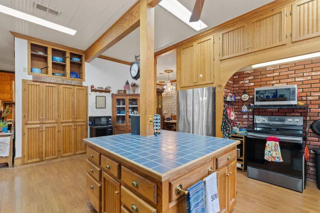 a view of a workspace with furniture and a workspace