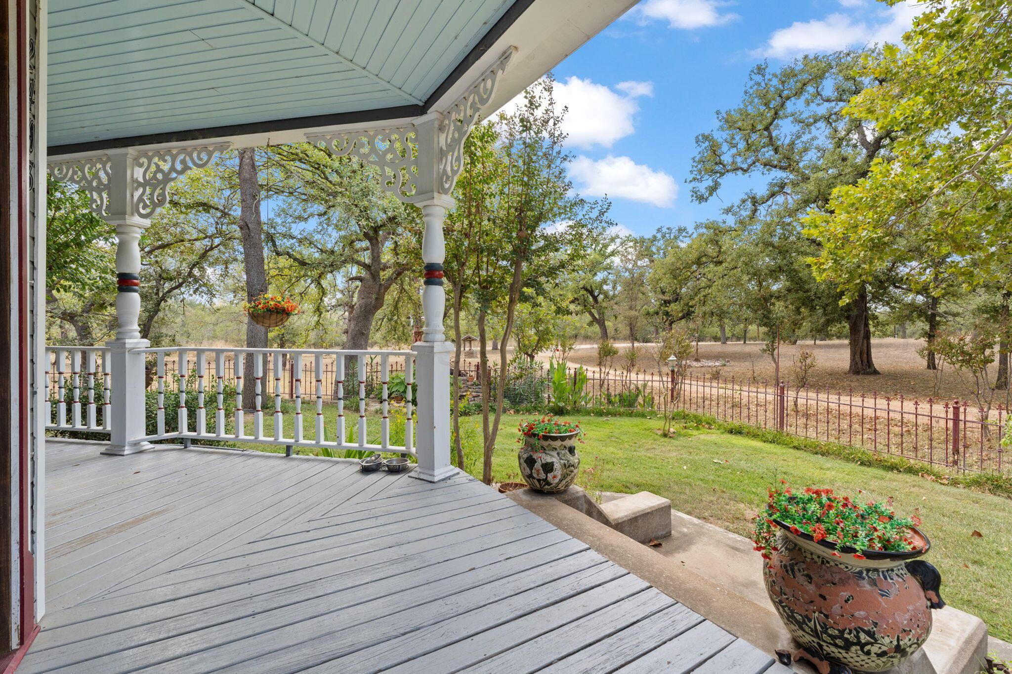2403 Maple Lane Kingsland, TX 78639 - Photo 2 of 46 a view of a deck with chair and floor to ceiling window