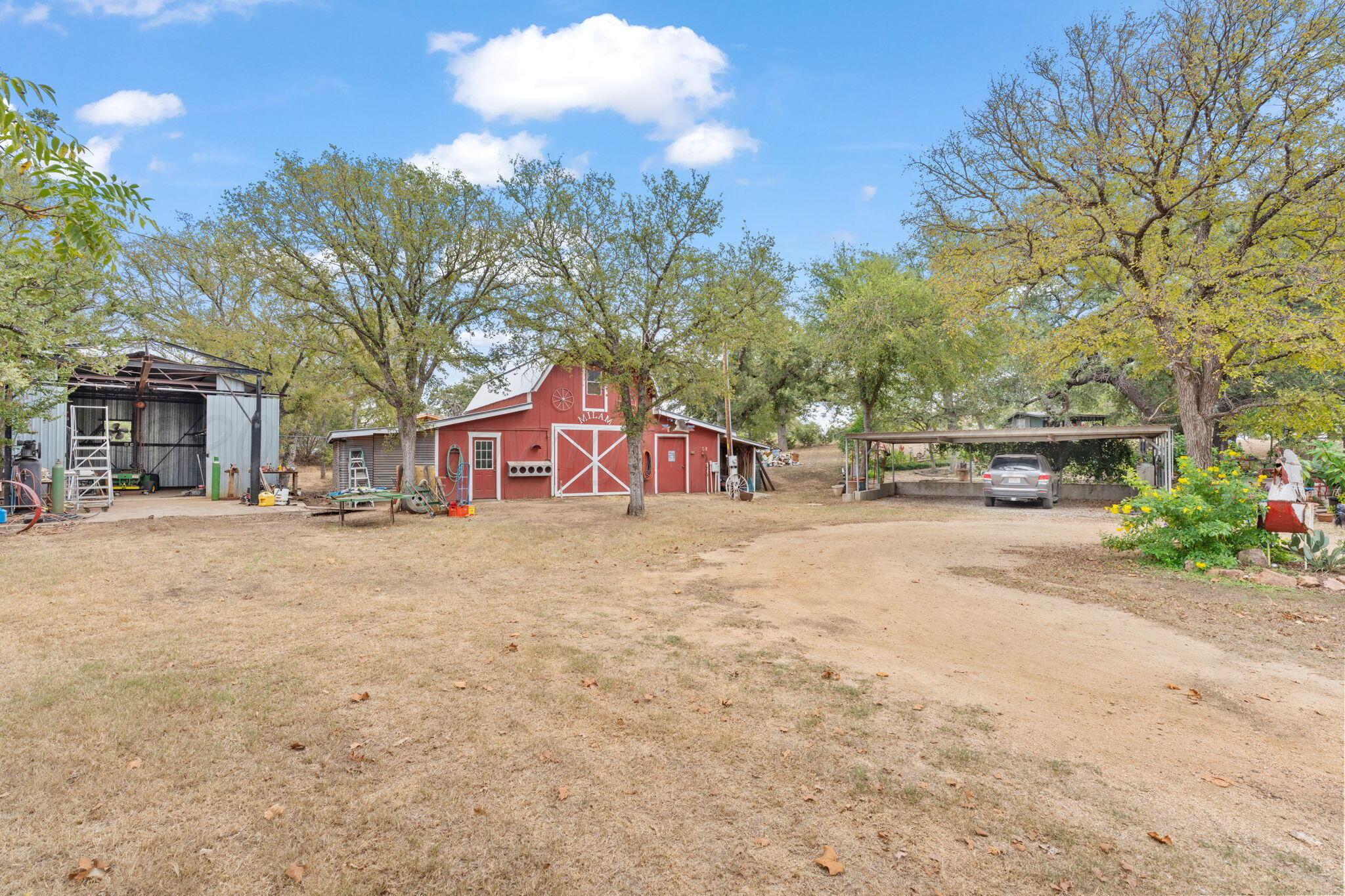2403 Maple Lane Kingsland, TX 78639 - Photo 29 of 46 a front view of a house with a yard and garage