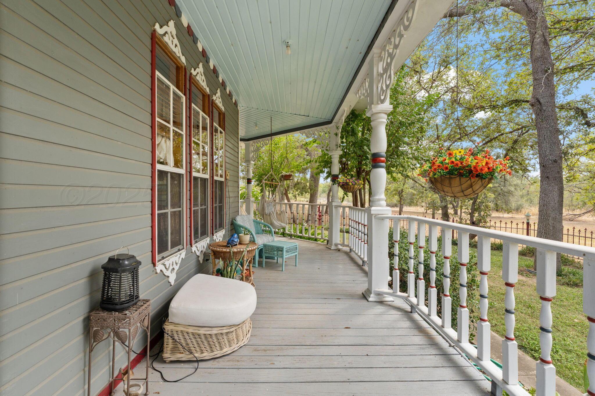 2403 Maple Lane Kingsland, TX 78639 - Photo 3 of 46 a view of a chairs and table in patio with wooden fence