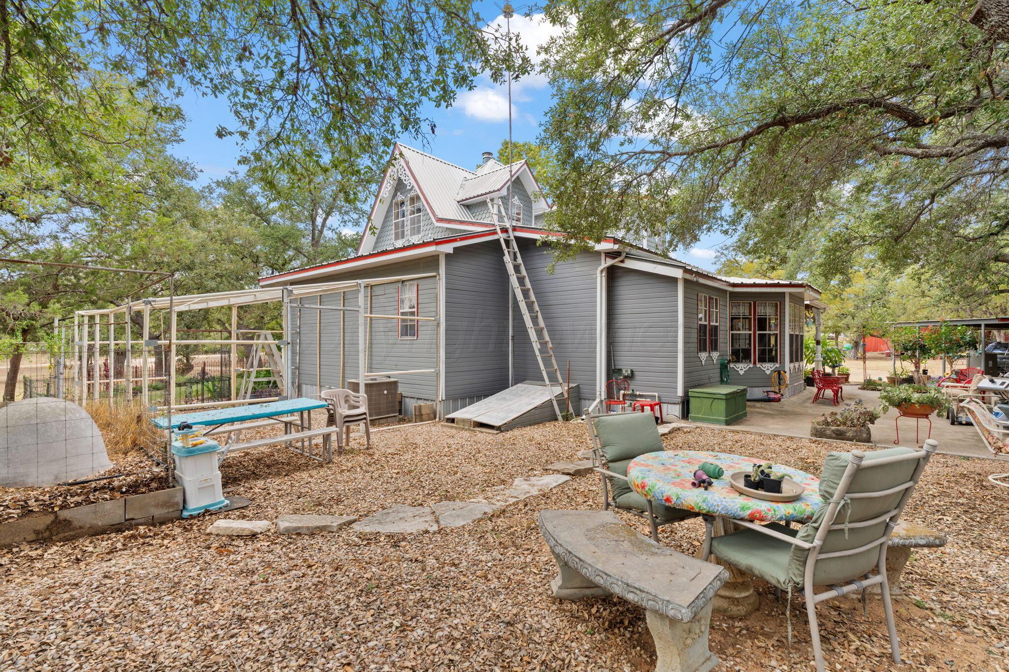 2403 Maple Lane Kingsland, TX 78639 - Photo 31 of 46 a backyard of a house with seating space