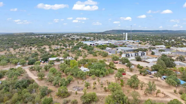 a view of a big yard with lots of green space