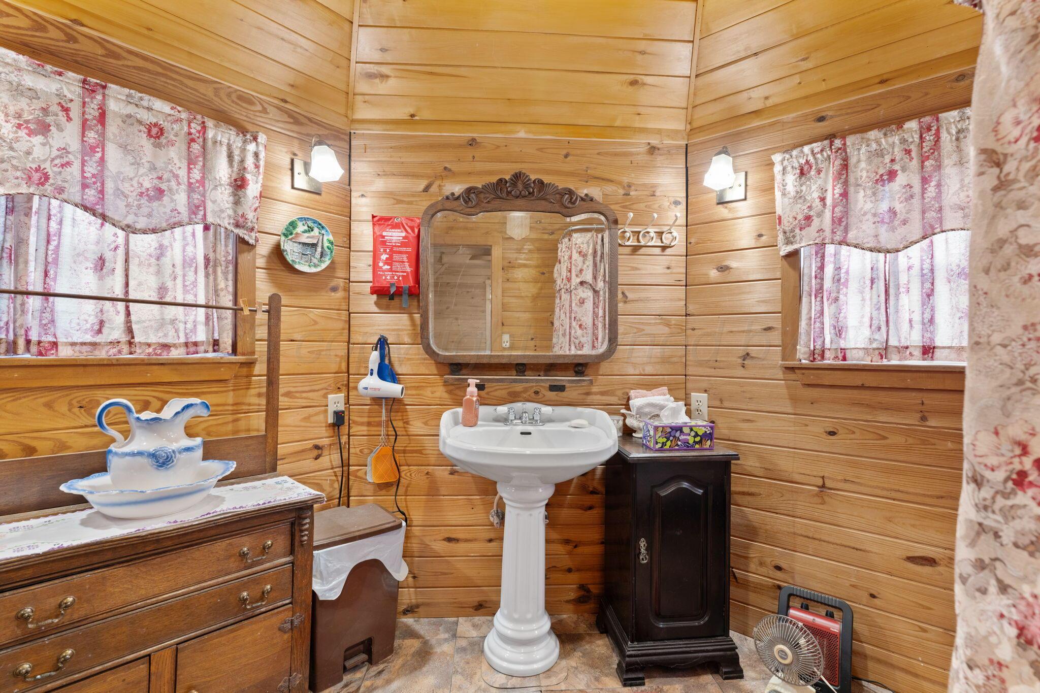 2403 Maple Lane Kingsland, TX 78639 - Photo 6 of 46 a bathroom with a sink and a mirror