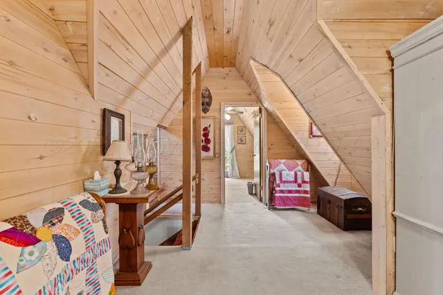 a bedroom with a bed and lamp