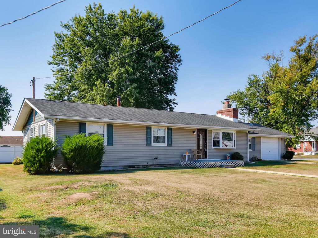 7003 River Drive Road Sparrows Point, MD 21219 - Photo 1 of 19 a front view of house with yard and lake view