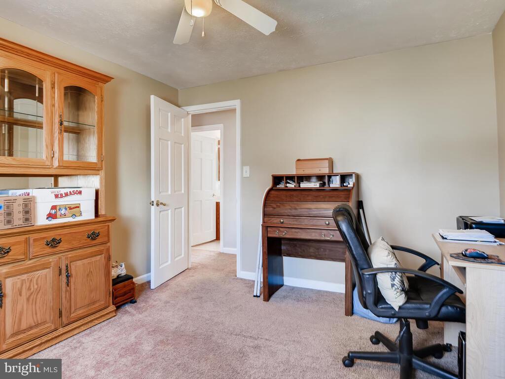 7003 River Drive Road Sparrows Point, MD 21219 - Photo 14 of 19 a room with a chair and white walls