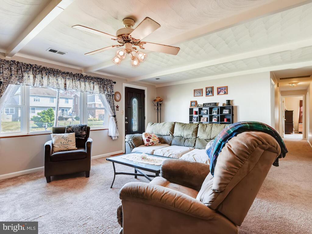 7003 River Drive Road Sparrows Point, MD 21219 - Photo 4 of 19 a living room with furniture and a large window