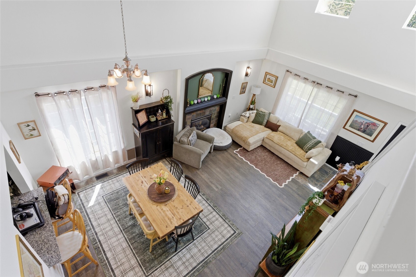 14005 Cedar Court Sultan, WA 98294 - Photo 25 of 38 a living room with furniture dining table and a fireplace