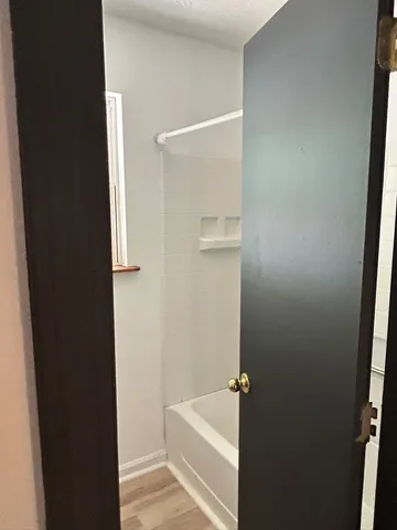 a view of room window and wooden floor