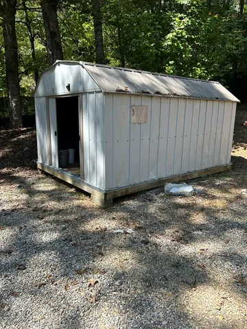 a view of a yard with trees