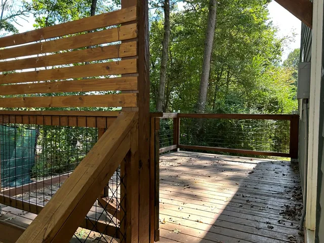 a view of balcony with wooden floor