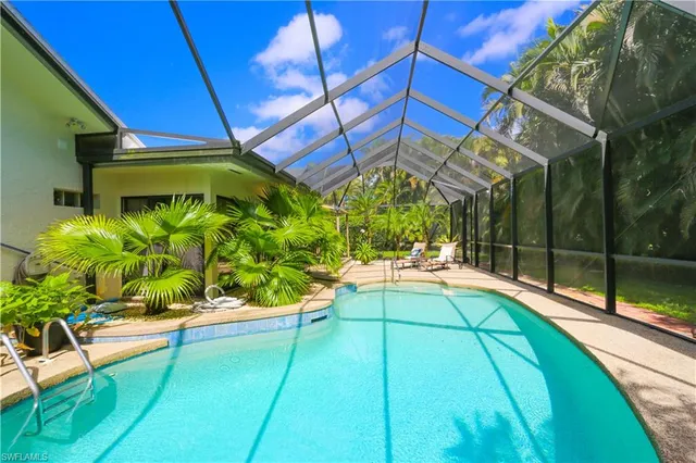 a view of a backyard tables and chairs