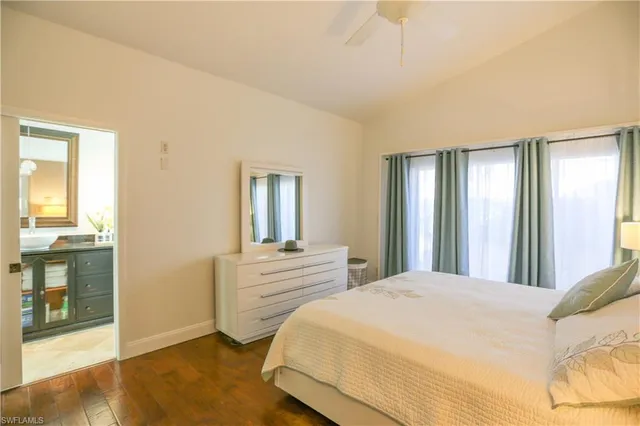 a bedroom with a bed and a mirror