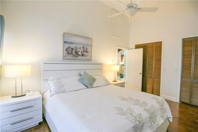 a bedroom with a bed and a lamp