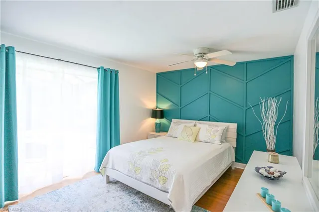 a bedroom with a bed and a dresser