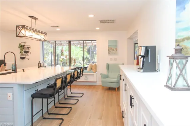 a view of a dining room with furniture window and outside view