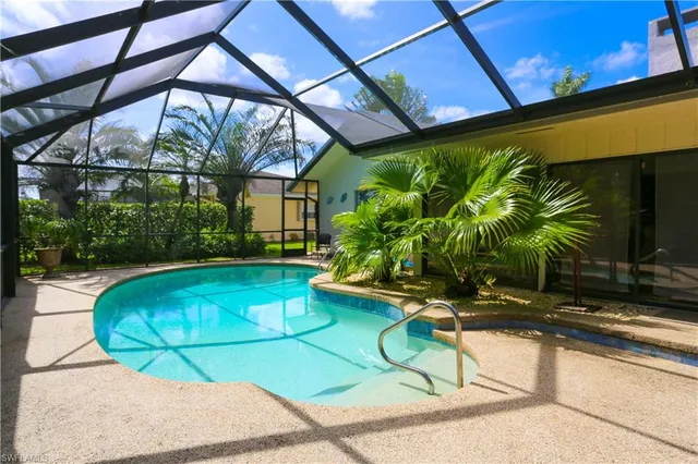a view of a swimming pool with a patio