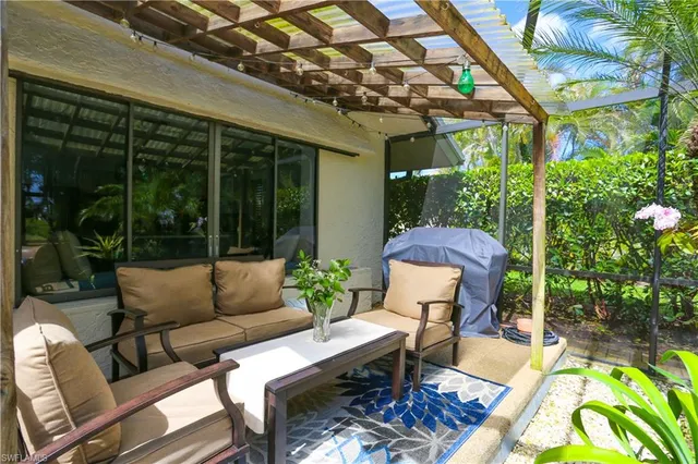 a outdoor living space with furniture and garden view