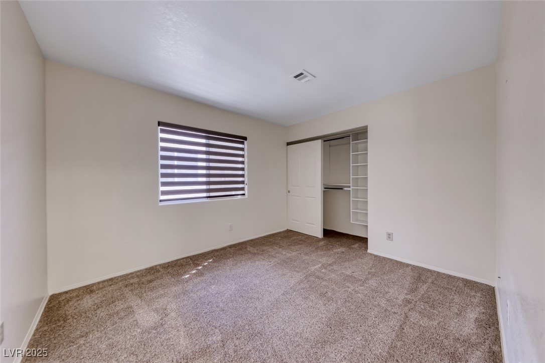 386 Nassau Way Boulder City, NV 89005 - Photo 23 of 44 Unfurnished bedroom with carpet floors and a closet