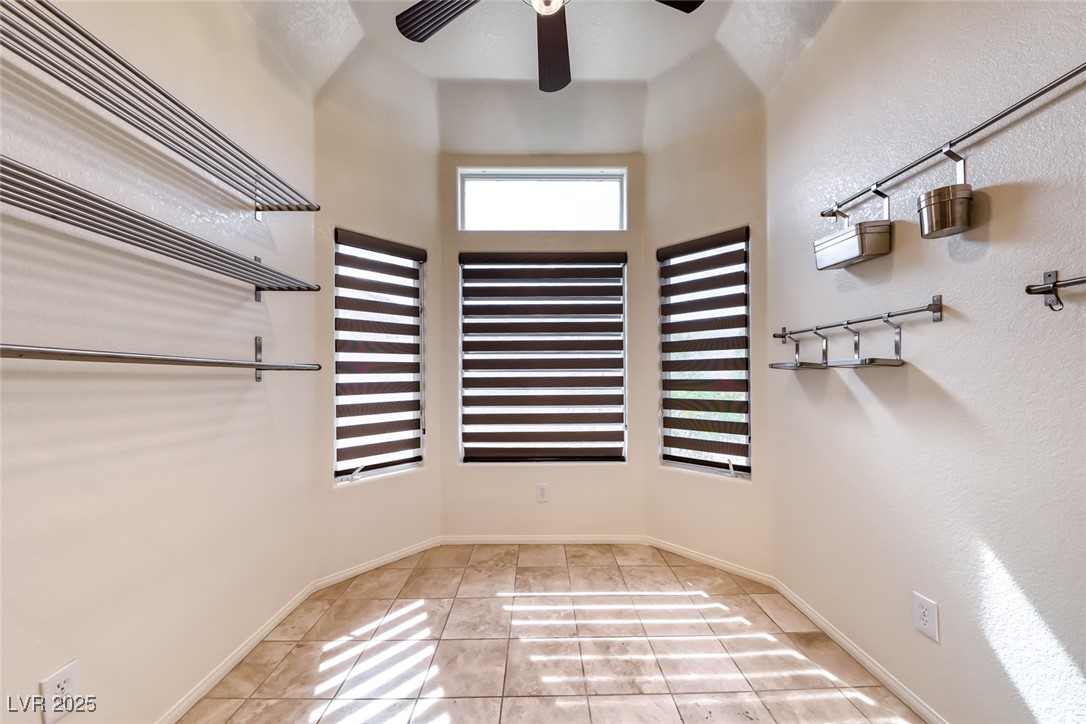 386 Nassau Way Boulder City, NV 89005 - Photo 30 of 44 Walk in closet featuring light tile patterned floors and ceiling fan