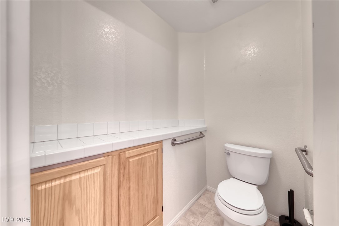 386 Nassau Way Boulder City, NV 89005 - Photo 34 of 44 Half bathroom featuring light tile patterned floors and toilet