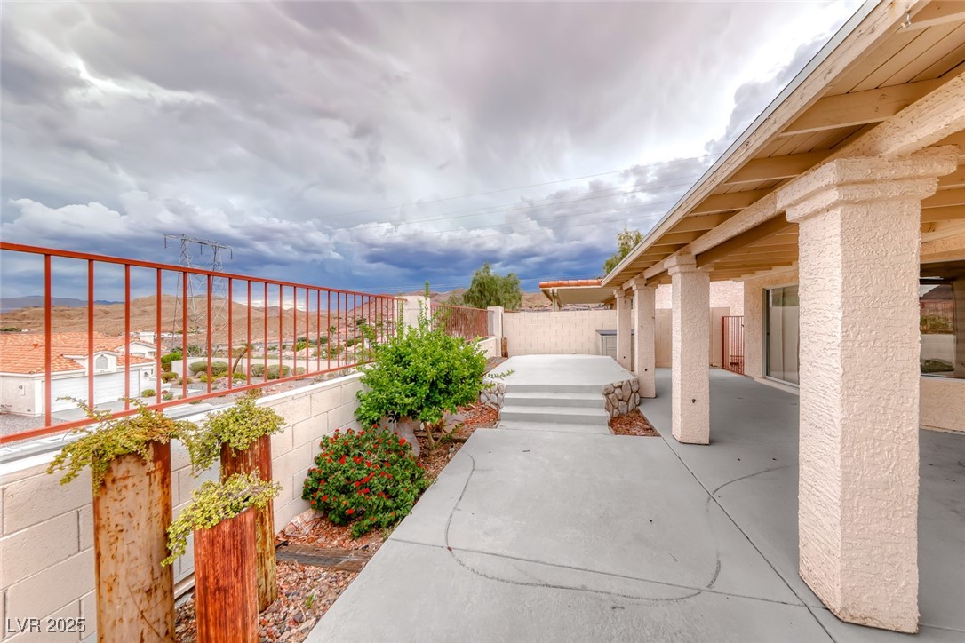 386 Nassau Way Boulder City, NV 89005 - Photo 4 of 44 Fenced backyard featuring a patio area