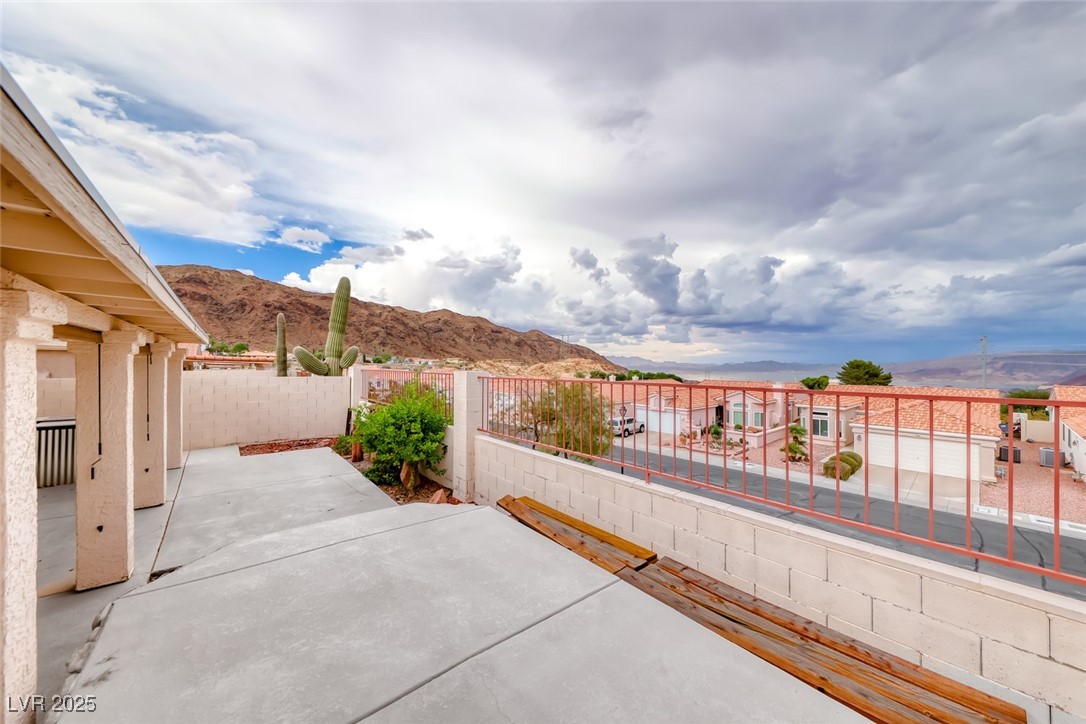 386 Nassau Way Boulder City, NV 89005 - Photo 5 of 44 Fenced backyard featuring a mountain view and a patio