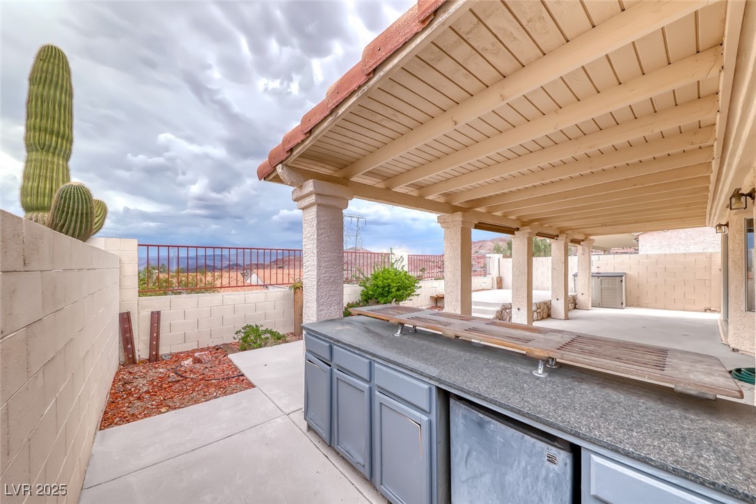 386 Nassau Way Boulder City, NV 89005 - Photo 8 of 44 Fenced backyard with a patio and area for grilling