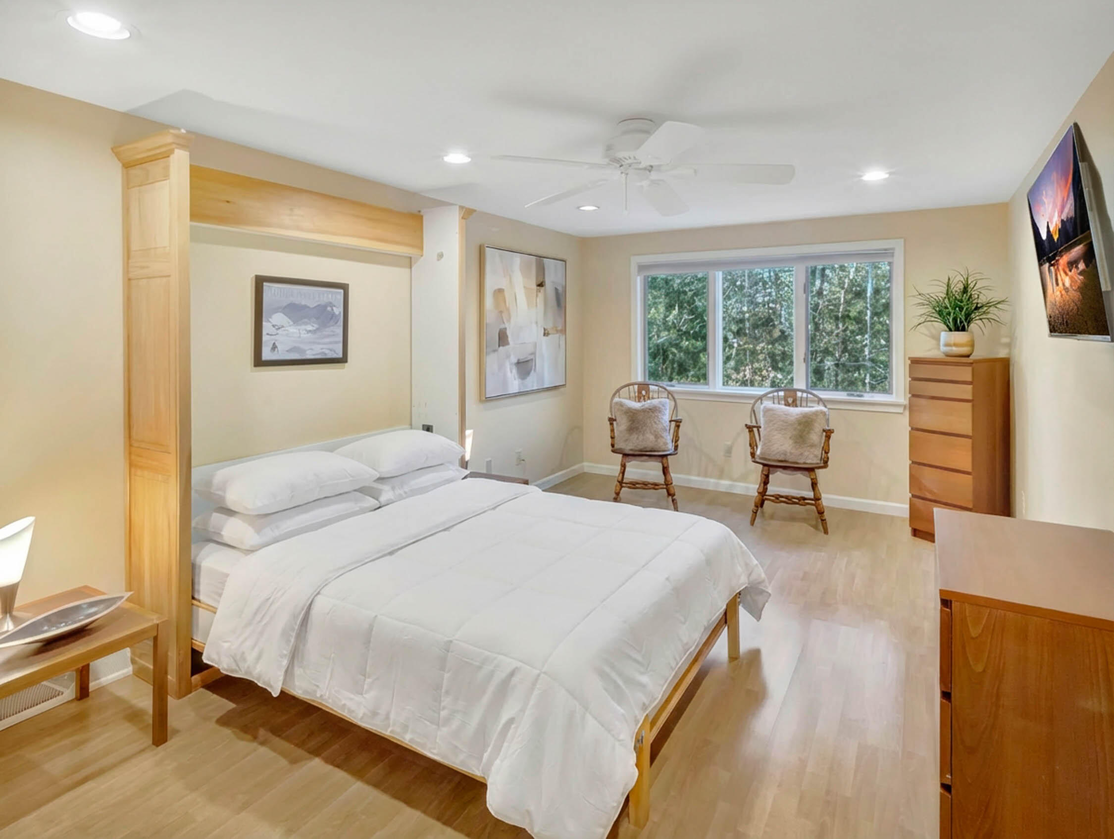 10 Kettle Lane Mashpee, MA 02649 - Photo 23 of 31 a bedroom with a bed and wooden floor